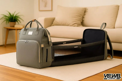 Velwel Wickelrucksack in Grau mit integriertem Babybett, praktisch und multifunktional.